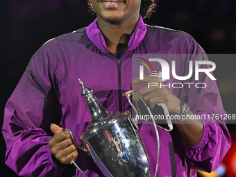 RIYADH, SAUDI ARABIA - NOVEMBER 09: Coco Gauff of the United States carries with the Billie Jean King Trophy after defeating Qinwen Zheng of...