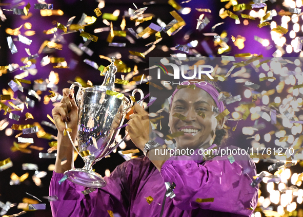 RIYADH, SAUDI ARABIA - NOVEMBER 09: Coco Gauff of the United States poses with the Billie Jean King Trophy after defeating Qinwen Zheng of C...