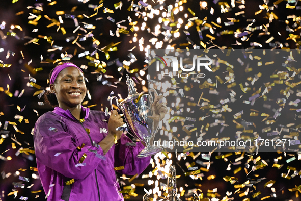 RIYADH, SAUDI ARABIA - NOVEMBER 09: Coco Gauff of the United States poses with the Billie Jean King Trophy after defeating Qinwen Zheng of C...