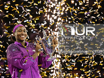 RIYADH, SAUDI ARABIA - NOVEMBER 09: Coco Gauff of the United States poses with the Billie Jean King Trophy after defeating Qinwen Zheng of C...