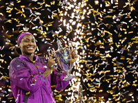 RIYADH, SAUDI ARABIA - NOVEMBER 09: Coco Gauff of the United States poses with the Billie Jean King Trophy after defeating Qinwen Zheng of C...