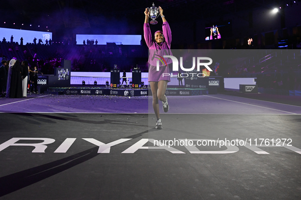 RIYADH, SAUDI ARABIA - NOVEMBER 09: Coco Gauff of the United States poses with the Billie Jean King Trophy after defeating Qinwen Zheng of C...