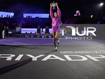 RIYADH, SAUDI ARABIA - NOVEMBER 09: Coco Gauff of the United States poses with the Billie Jean King Trophy after defeating Qinwen Zheng of C...