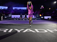 RIYADH, SAUDI ARABIA - NOVEMBER 09: Coco Gauff of the United States poses with the Billie Jean King Trophy after defeating Qinwen Zheng of C...