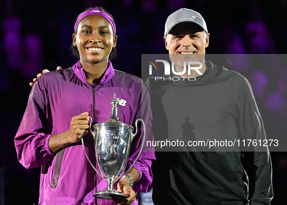 RIYADH, SAUDI ARABIA - NOVEMBER 09: Coco Gauff of the United States poses with her coach Matt Daly, after defeating Qinwen Zheng of China du...