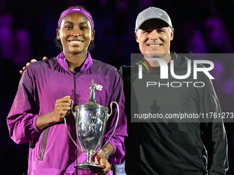 RIYADH, SAUDI ARABIA - NOVEMBER 09: Coco Gauff of the United States poses with her coach Matt Daly, after defeating Qinwen Zheng of China du...