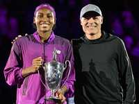 RIYADH, SAUDI ARABIA - NOVEMBER 09: Coco Gauff of the United States poses with her coach Matt Daly, after defeating Qinwen Zheng of China du...