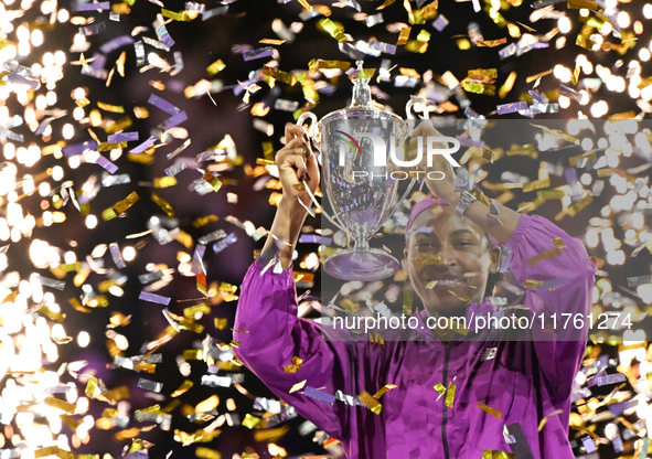 RIYADH, SAUDI ARABIA - NOVEMBER 09: Coco Gauff of the United States poses with the Billie Jean King Trophy after defeating Qinwen Zheng of C...