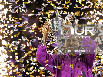 RIYADH, SAUDI ARABIA - NOVEMBER 09: Coco Gauff of the United States poses with the Billie Jean King Trophy after defeating Qinwen Zheng of C...