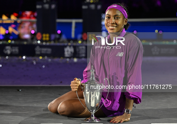 RIYADH, SAUDI ARABIA - NOVEMBER 09: Coco Gauff of the United States poses with the Billie Jean King Trophy after defeating Qinwen Zheng of C...