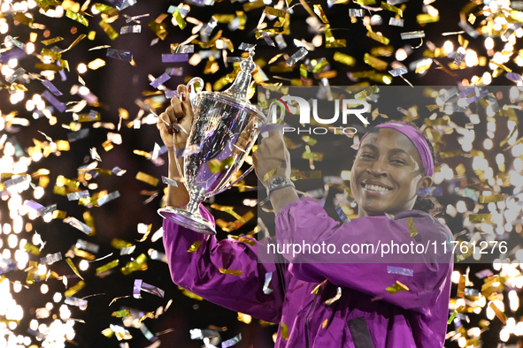 RIYADH, SAUDI ARABIA - NOVEMBER 09: Coco Gauff of the United States poses with the Billie Jean King Trophy after defeating Qinwen Zheng of C...