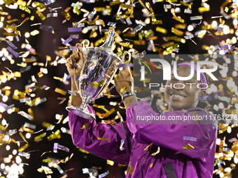 RIYADH, SAUDI ARABIA - NOVEMBER 09: Coco Gauff of the United States poses with the Billie Jean King Trophy after defeating Qinwen Zheng of C...