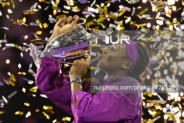 RIYADH, SAUDI ARABIA - NOVEMBER 09: Coco Gauff of the United States poses with the Billie Jean King Trophy after defeating Qinwen Zheng of C...