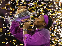 RIYADH, SAUDI ARABIA - NOVEMBER 09: Coco Gauff of the United States poses with the Billie Jean King Trophy after defeating Qinwen Zheng of C...