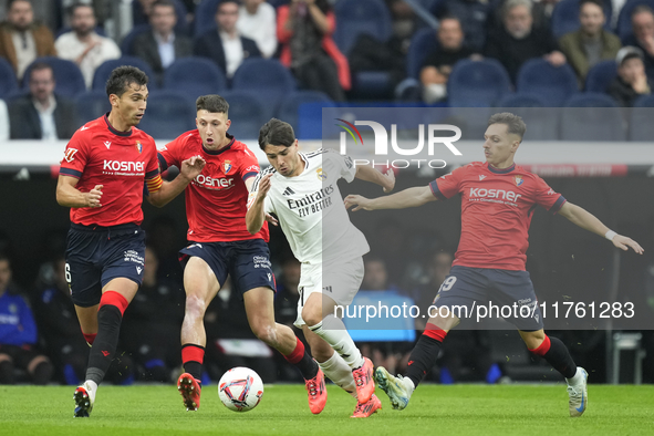 Brahim Diaz attacking midfield of Real Madrid and Spain surrounded by Osasuna's players the La Liga match between Real Madrid CF and CA Osas...