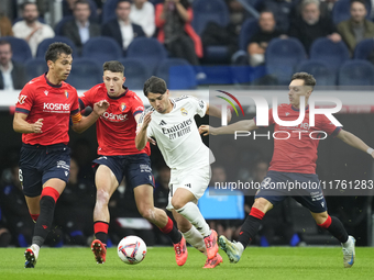 Brahim Diaz attacking midfield of Real Madrid and Spain surrounded by Osasuna's players the La Liga match between Real Madrid CF and CA Osas...