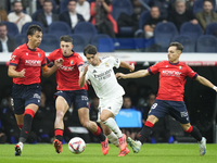 Brahim Diaz attacking midfield of Real Madrid and Spain surrounded by Osasuna's players the La Liga match between Real Madrid CF and CA Osas...