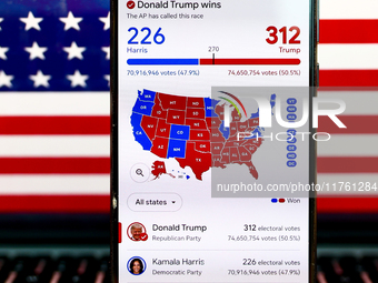 Google graphic with the final US presidential results is screened on a mobile phone for illustration photo on November 10th, 2024 in Berlin,...