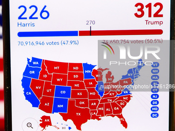 Google graphic with the final US presidential results is screened on a mobile phone for illustration photo on November 10th, 2024 in Berlin,...