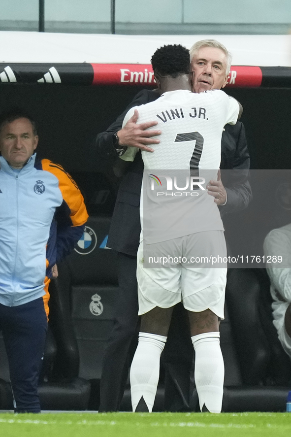 Vinicius Junior left winger of Real Madrid and Brazil celebrates after scoring his sides first goal with Carlo Ancelotti head coach of Real...