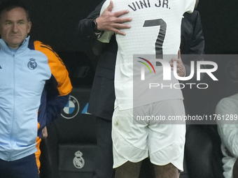 Vinicius Junior left winger of Real Madrid and Brazil celebrates after scoring his sides first goal with Carlo Ancelotti head coach of Real...