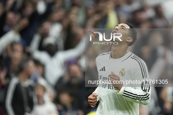 Jude Bellingham central midfield of Real Madrid and England celebrates after scoring his sides first goal during the La Liga match between R...