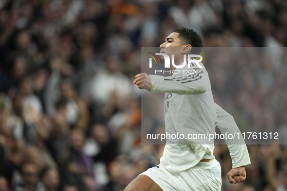 Jude Bellingham central midfield of Real Madrid and England celebrates after scoring his sides first goal during the La Liga match between R...