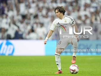 Fran Garcia left-back of Real Madrid and Spain controls the ball during the La Liga match between Real Madrid CF and CA Osasuna at Estadio S...