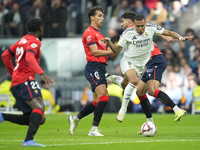 Kylian Mbappe centre-forward of Real Madrid and France surrounded by Oasuna's players during the La Liga match between Real Madrid CF and CA...