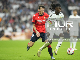 Eduardo Camavinga central midfield of Real Madrid and France and Ante Budimir centre-forward of Osasuna and Croatia compete for the ball dur...