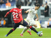 Brahim Diaz attacking midfield of Real Madrid and Spain and Enzo Boyomo centre-back of Osasuna and Cameroon compete for the ball during the...