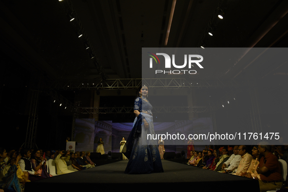 A city industrialist in Indian traditional dress walks the runway during a fashion show organized by Lions International at JW Marriott in K...