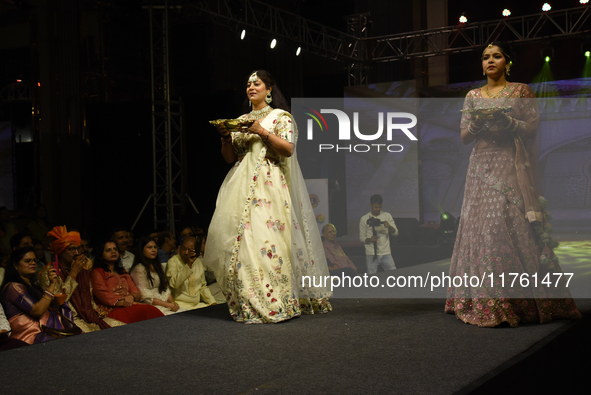 A city industrialist in Indian traditional dress walks the runway during a fashion show organized by Lions International at JW Marriott in K...