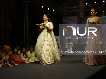 A city industrialist in Indian traditional dress walks the runway during a fashion show organized by Lions International at JW Marriott in K...