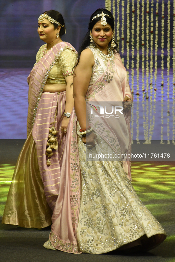 A city industrialist in Indian traditional dress walks the runway during a fashion show organized by Lions International at JW Marriott in K...