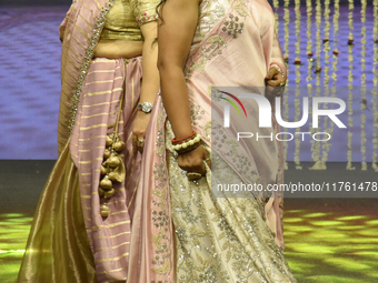 A city industrialist in Indian traditional dress walks the runway during a fashion show organized by Lions International at JW Marriott in K...