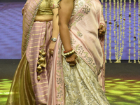 A city industrialist in Indian traditional dress walks the runway during a fashion show organized by Lions International at JW Marriott in K...