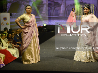 A city industrialist in Indian traditional dress walks the runway during a fashion show organized by Lions International at JW Marriott in K...