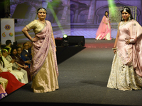 A city industrialist in Indian traditional dress walks the runway during a fashion show organized by Lions International at JW Marriott in K...