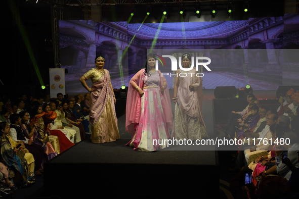 A city industrialist in Indian traditional dress walks the runway during a fashion show organized by Lions International at JW Marriott in K...