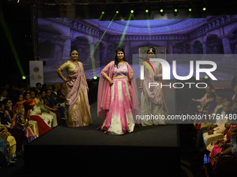 A city industrialist in Indian traditional dress walks the runway during a fashion show organized by Lions International at JW Marriott in K...