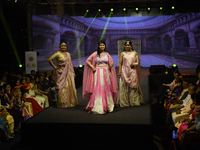 A city industrialist in Indian traditional dress walks the runway during a fashion show organized by Lions International at JW Marriott in K...