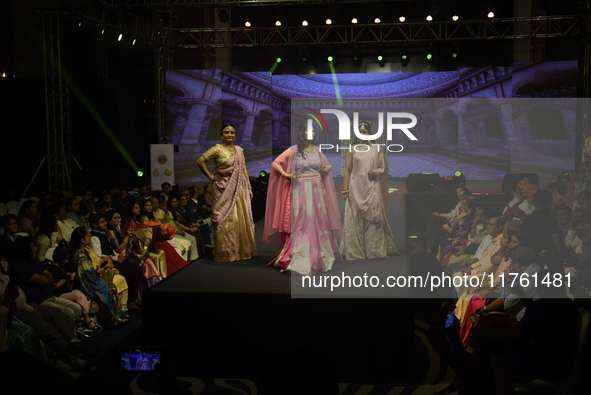 A city industrialist in Indian traditional dress walks the runway during a fashion show organized by Lions International at JW Marriott in K...