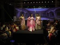 A city industrialist in Indian traditional dress walks the runway during a fashion show organized by Lions International at JW Marriott in K...