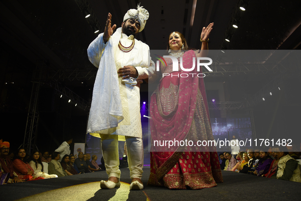 A city industrialist in Indian traditional dress walks the runway during a fashion show organized by Lions International at JW Marriott in K...