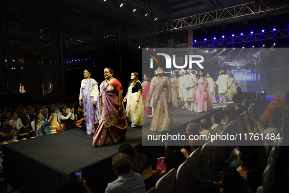 A city industrialist in Indian traditional dress walks the runway during a fashion show organized by Lions International at JW Marriott in K...