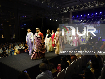 A city industrialist in Indian traditional dress walks the runway during a fashion show organized by Lions International at JW Marriott in K...