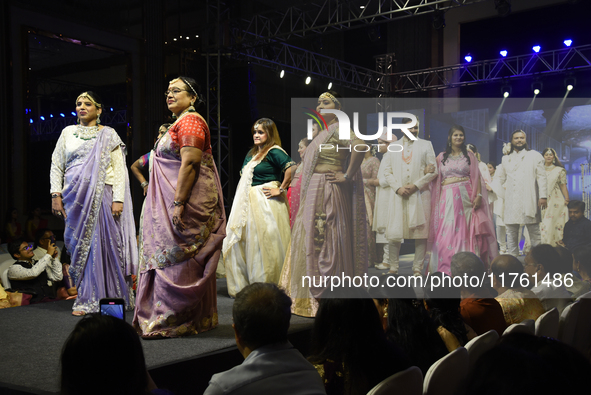 A city industrialist in Indian traditional dress walks the runway during a fashion show organized by Lions International at JW Marriott in K...