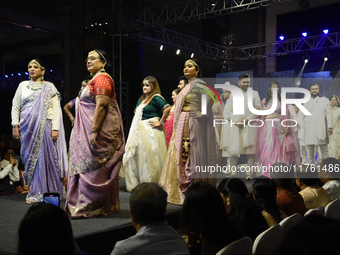 A city industrialist in Indian traditional dress walks the runway during a fashion show organized by Lions International at JW Marriott in K...