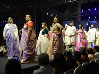 A city industrialist in Indian traditional dress walks the runway during a fashion show organized by Lions International at JW Marriott in K...